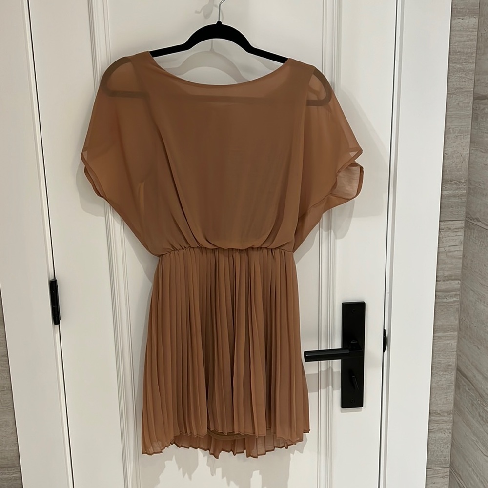 Chiffon cocktail dress with open back and pleated skirt